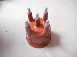 Virranjakajan kansi  KW 806 249.  OE OPEL 1211000.   Opel Corsa A,   Kadett E,   Astra F,   Vectra A,  (1.4,  1.6 bensiini)